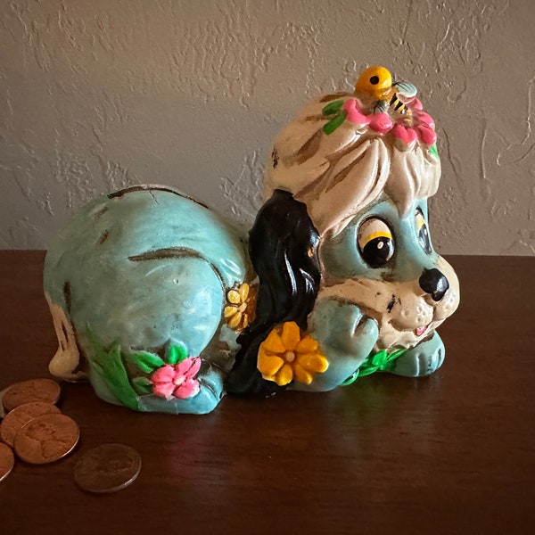 OSL 1969 Chalkware Puppy Dog Laying Amongst The Flowers - Coin Bank Made In Japan