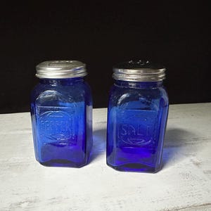 1950’s Vintage Cobalt Blue Glass Translucent Embossed Salt and Pepper Shakers with Tin Lid