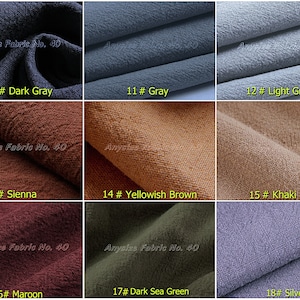 May include: A close-up of 18 fabric swatches in various colors, including dark gray, light gray, sienna, yellowish brown, khaki, maroon, dark sea green, and silver. The swatches are arranged in a grid of three rows and six columns. Each swatch has a number and color name printed below it. The text "Anysize Fabric No. 40" appears on several of the swatches.