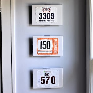 BibMount™ Race Bib Frame Display Invisible and Adjustable Wall Mount or Shelf Stand. image 1