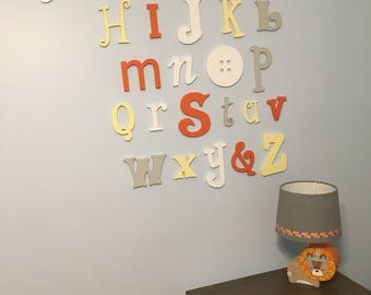 unfinished wooden alphabet set in mixed fonts and sizes