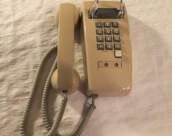 1990s Cortelco push button wall mount beige phone USA nostalgic electronic landline