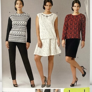 May include: Simplicity sewing pattern 1255 for sizes 20W-28W. The package displays three garment variations: a black and white patterned long-sleeve top with black trousers, a white lace sleeveless top with a matching skirt, and a red and black patterned long-sleeve top with a black skirt.