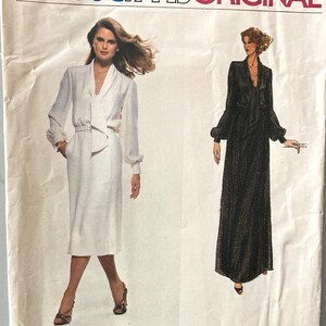 May include: A Vogue Paris Original sewing pattern envelope for Pierre Balmain design 1857. The front features illustrations of two dresses: a white knee-length dress with a belted waist and a long-sleeved black floor-length dress with a tie neck.