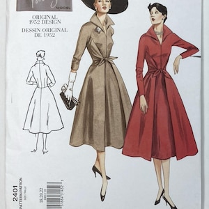 May include: A Vogue Vintage Model sewing pattern envelope for a 1952 design, number 2401. The cover features illustrations of two dresses with collared necklines, long sleeves, and belted waists, one in tan and one in red, plus a line drawing.