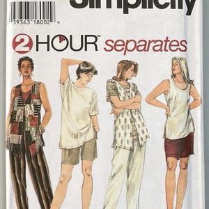 May include: A Simplicity 9546 sewing pattern envelope for 2 Hour separates in size GG 26W-32W. The cover features illustrations of four outfits including a patchwork vest, loose t-shirts, a patterned tunic, and shorts, showcasing various clothing styles.