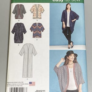 May include: A Simplicity 1108 sewing pattern envelope for an easy-to-sew open-front cardigan. The package displays illustrations of five variations of the garment in different lengths and patterns, along with photographs of two models wearing the finished cardigan.