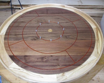 Round sided Crokinole board with 26 inch tournament size Walnut top and maple sides.