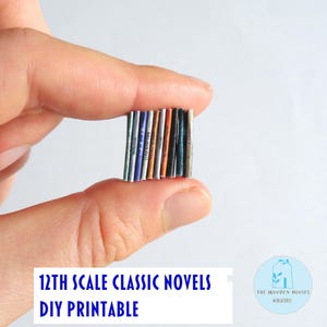 May include: A collection of miniature 12th scale classic novels, DIY printable. The books have colourful spines and are held between fingers. The text "12TH SCALE CLASSIC NOVELS DIY PRINTABLE" is displayed in blue.
