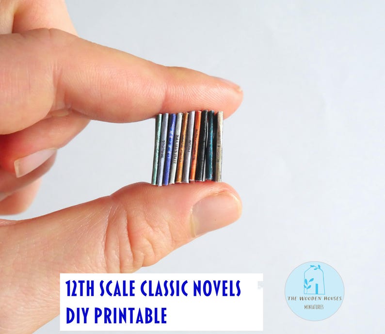 May include: A collection of miniature 12th scale classic novels, DIY printable. The books have colourful spines and are held between fingers. The text "12TH SCALE CLASSIC NOVELS DIY PRINTABLE" is displayed in blue.