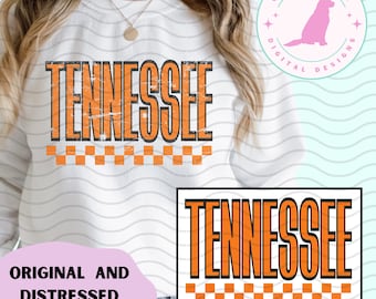 May include: White sweatshirt with the word "TENNESSEE" in orange block letters with a distressed effect. The design includes a checkered orange and white border at the bottom of the text. A smaller version of the design is in the lower right corner.