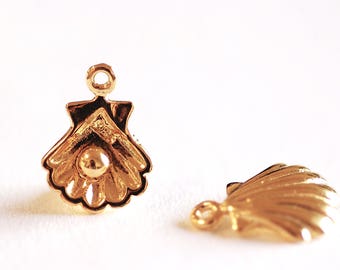 May include: Two gold-colored metal shell-shaped charms with a loop at the top for attaching to jewelry or other crafts.