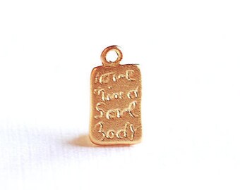 May include: Gold charm with the words "Not that I'm a snob, but..." and "Soul Body" engraved on it.