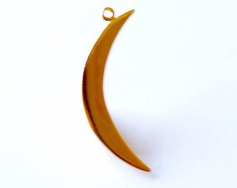 May include: A gold crescent moon charm with a loop at the top for attaching to a necklace or bracelet.
