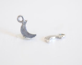 May include: Two silver crescent moon charms with a jump ring for attaching to jewellery or crafts.