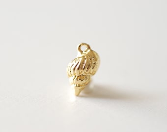 May include: A gold-colored seashell charm pendant. The seashell is detailed and has a spiral shape.