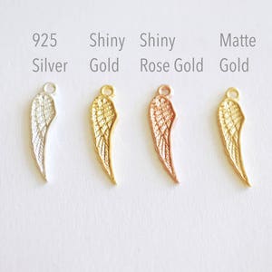 May include: Four angel wing charms in different finishes: 925 Silver, Shiny Gold, Shiny Rose Gold, and Matte Gold.