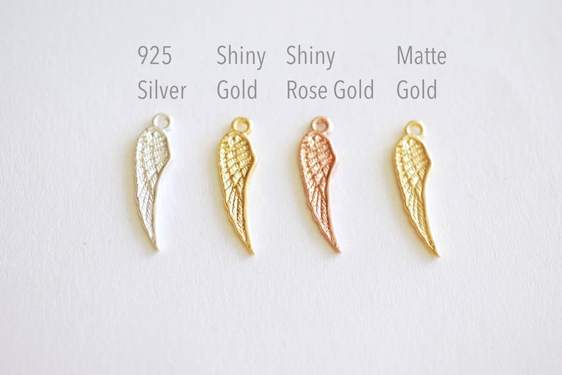 May include: Four angel wing charms in different finishes: 925 Silver, Shiny Gold, Shiny Rose Gold, and Matte Gold.