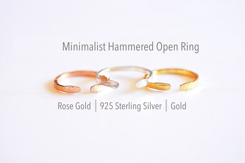 May include: Three minimalist hammered open rings in rose gold, sterling silver, and gold.