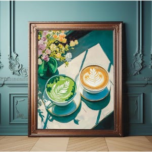 May include: A painting of two cups of coffee on a white surface. One cup is filled with green matcha latte and the other with a brown latte. Both cups have a white foam design on top. The cups are on a white surface with a green vase of flowers in the background.