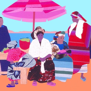 May include: A group of people gathered under a pink and white striped umbrella. The people are wearing colorful clothing and head coverings. There is a table with fruit and vegetables on it. The scene is set against a blue sky and water.