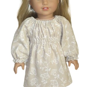 18 inch doll dress.  Tan with white flowers and shirred bodice.  American made girl doll clothes.