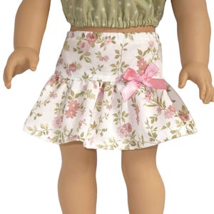 18" doll skirt.  White ruffle mini skirt with pink flowers and bow.   American made girl doll clothes.