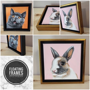 May include: A black floating frame with a white and gray rabbit painting on a pink background. The frame has a gold border. The rabbit is looking to the right. The painting is on a canvas.