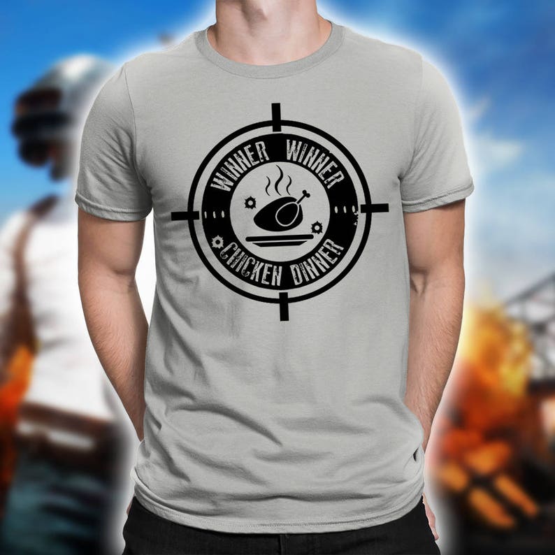 May include: A gray t-shirt with a black graphic of a chicken dinner in a crosshairs. The graphic says "Winner Winner Chicken Dinner".