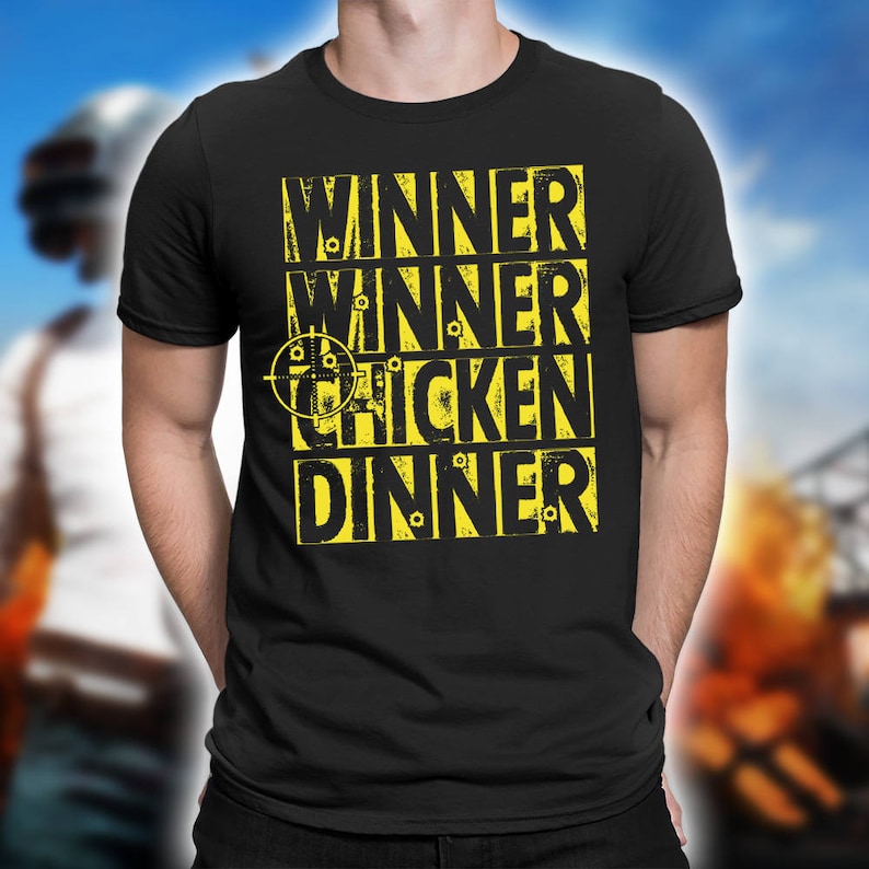 May include: Black t-shirt with a yellow graphic that says "Winner Winner Chicken Dinner" with a target symbol and bullet holes.
