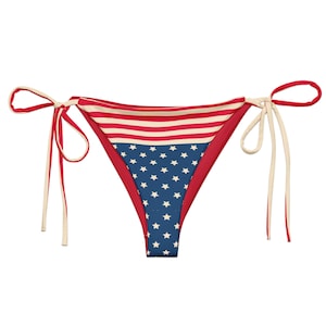 May include: Red, white, and blue bikini bottom with a stars and stripes pattern. The bikini bottom has adjustable ties.