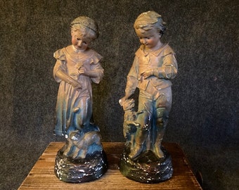 Early plaster figures boy girl with dogs