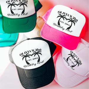 May include: Five trucker hats with white front panels and mesh back panels. The front panels feature a black graphic of palm trees with the text "Olivia's 21st" and "Est. 2004". The hats are in different colours: green, pink, black, white, and turquoise.