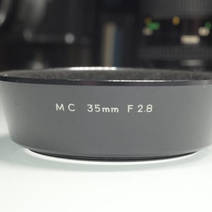 Minolta MC 28mm F2.5 lens hood