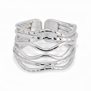 May include: Silver ring with five wavy bands, each with a different textured surface.