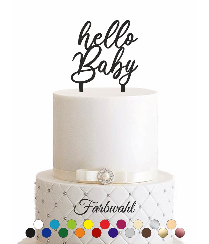 May include: Black acrylic cake topper with the words "hello Baby" in a cursive font. The topper is shown on a white cake with a white ribbon and a pearl embellishment. A color chart is shown below the cake with 20 different color options.