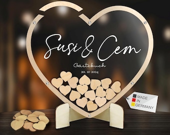 Elegante libro de visitas en forma de corazón, fabricado en madera y cristal acrílico —transparente por ambas caras—, de alta calidad y elaborado en Baviera.