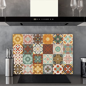 May include: A decorative kitchen backsplash featuring a patchwork of colorful, patterned tiles in shades of yellow, orange, teal, and brown. The design is reminiscent of traditional tilework. The backsplash is rectangular and sits behind a stovetop.