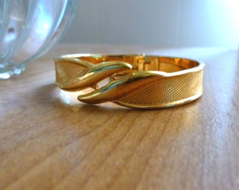 1990s MONET Fancy Costume Hinged Cuff 3/8x6.25 Inch Gold Toned Enamel Shiny