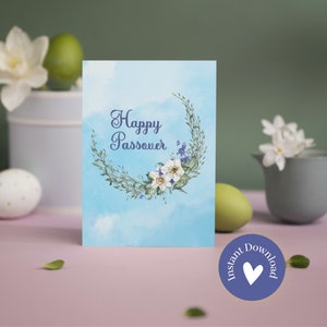 May include: A blue and white printable card with a floral wreath and the text "Happy Passover".
