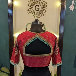 Red brocade bridal blouse with aari work