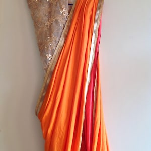 Orange Semi Silk Saree: Embroidered Sequin Net Blouse