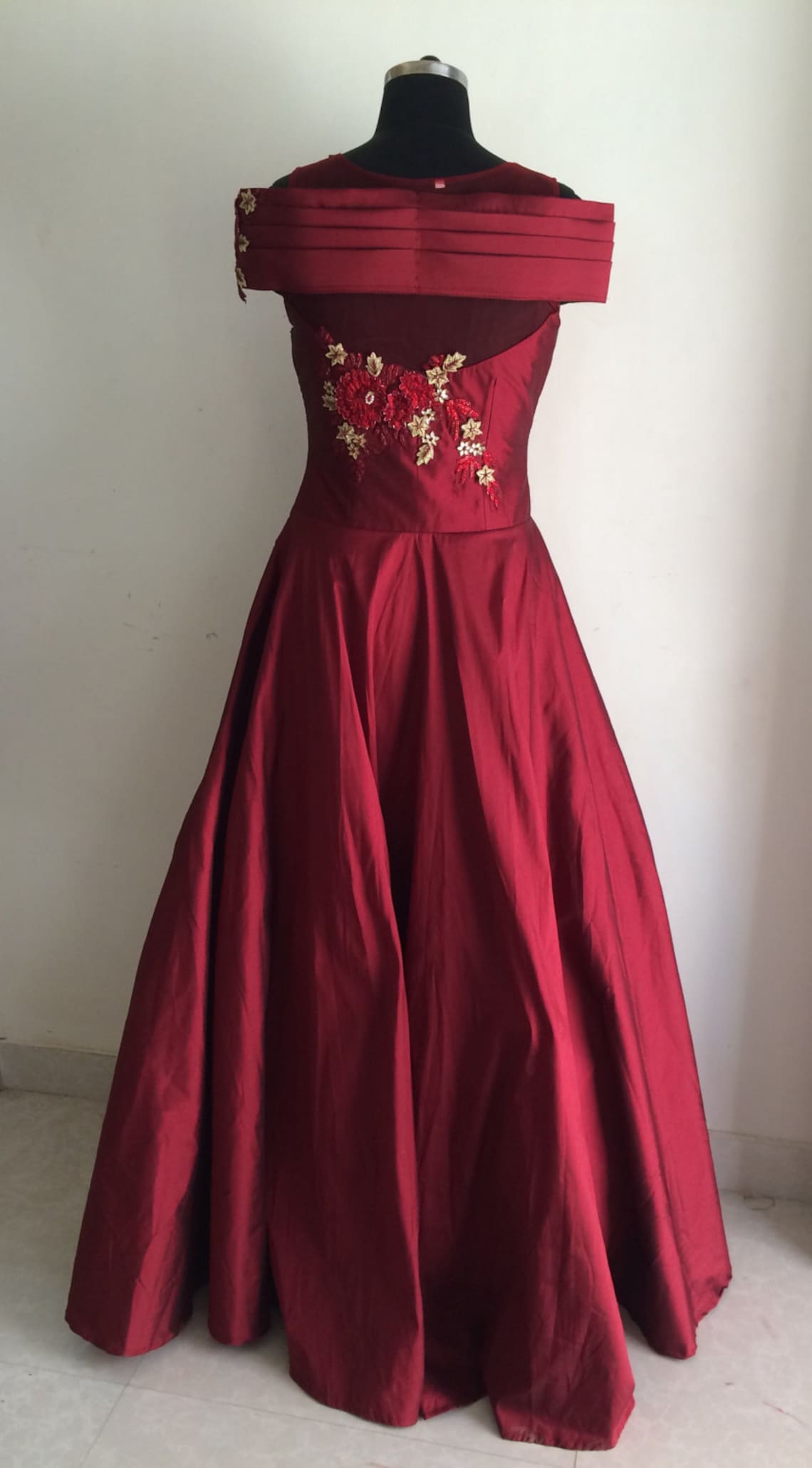 black and maroon gown