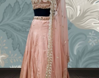 Blush lehenga satin georgette and blush hand  embroidered blouse with sequin embroidery net dupatta in blush