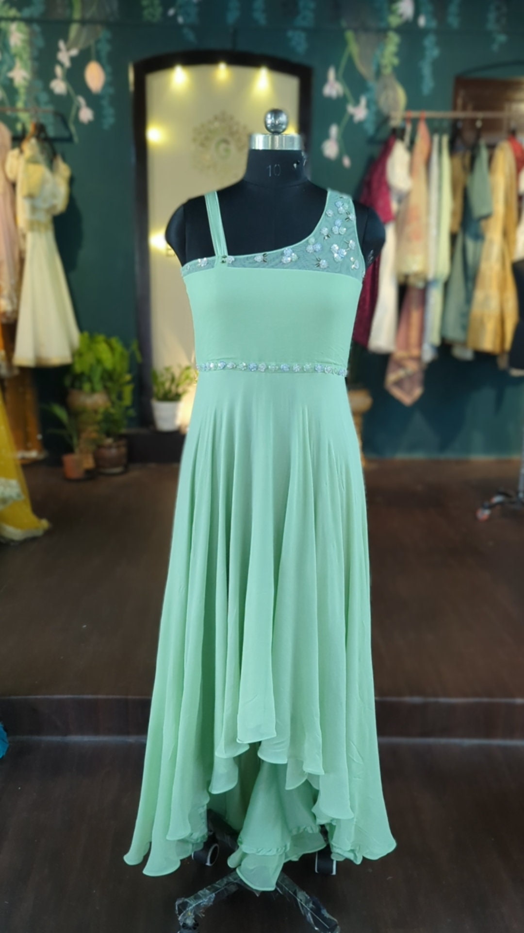 Pista Green Embroidered Floor Length Net Gown & Flared Sleeves