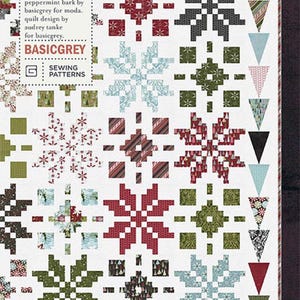 May include: A quilt pattern titled "Woven Noel" featuring snowflake and geometric designs in red, green, gray, and blue on a white background. The pattern includes the text "PAT051" and "BASICGREY".