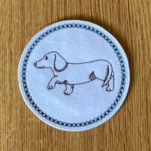 421.  Dachshund coaster.