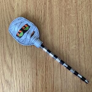 1165. Mummy pencil topper.