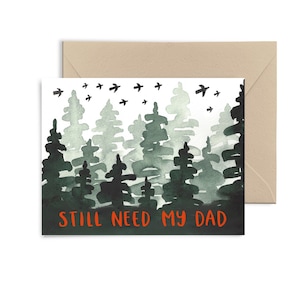 May include: A watercolor illustration of a forest with a dark green and gray color scheme. The text "STILL NEED MY DAD" is written in red at the bottom of the card.