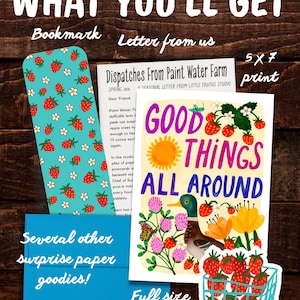 May include: A stationery set including a teal bookmark with a strawberry and daisy pattern, a 5x7 inch print with the text Good Things All Around, a letter titled Dispatches From Paint Water Farm, a blue envelope, and a strawberry basket sticker.